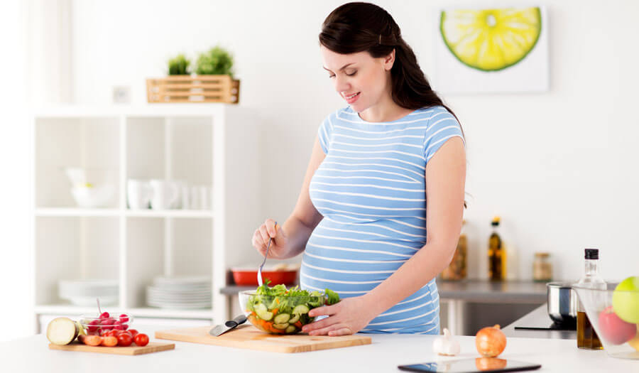 Pregnant Women Preparing Food